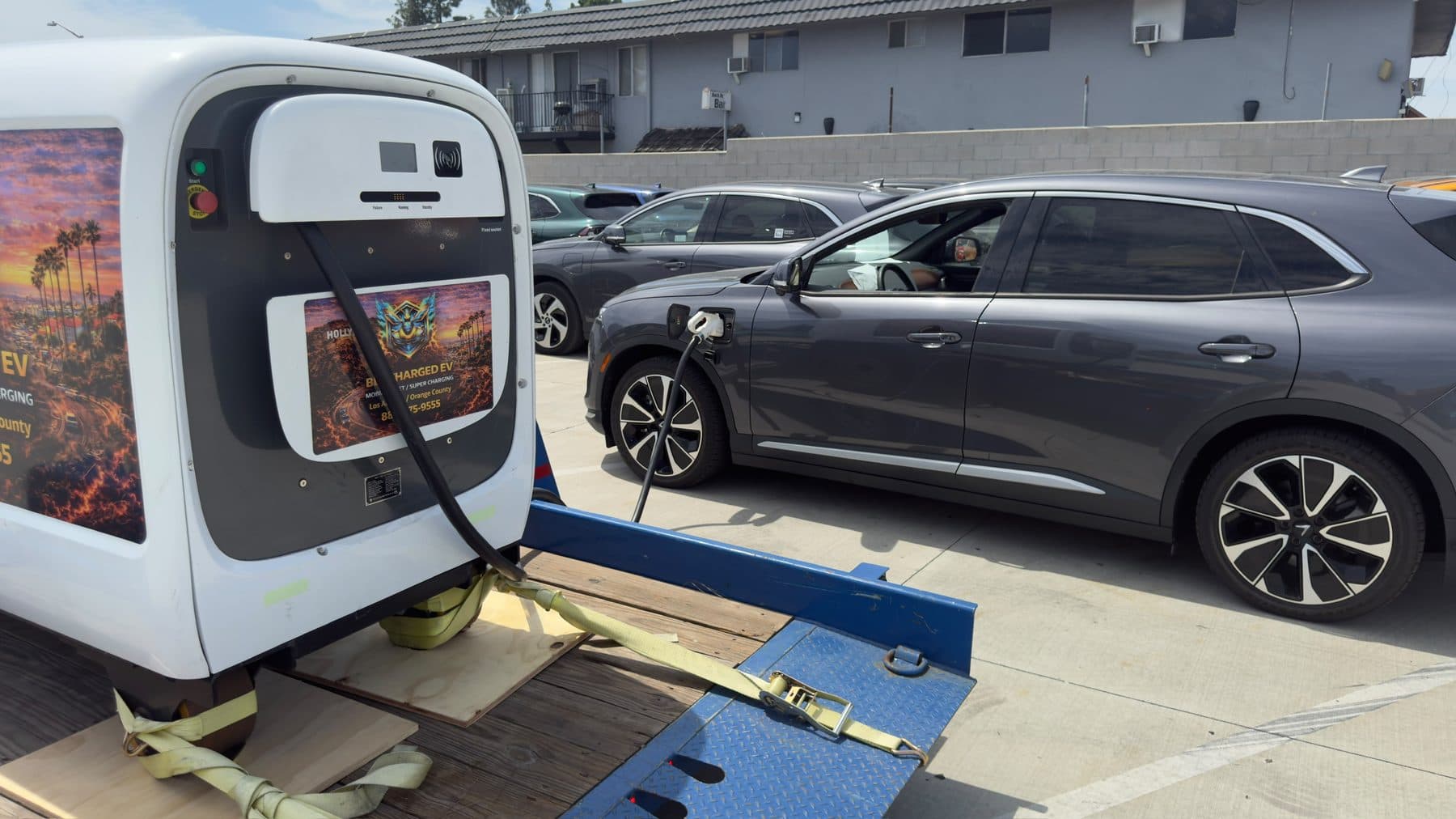 Mobile DC fast charger on a trailer charging an electric SUV